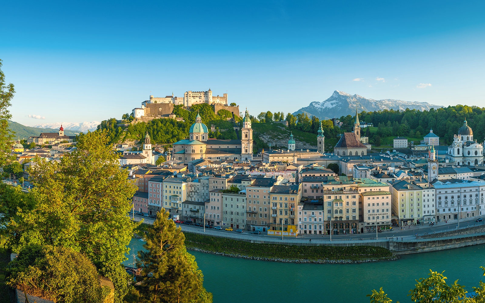 Panoramic view from Kapuzinerberg over the Salzburg Old Town, Hohensalzburg Fortress, Salzach River, and Untersberg.